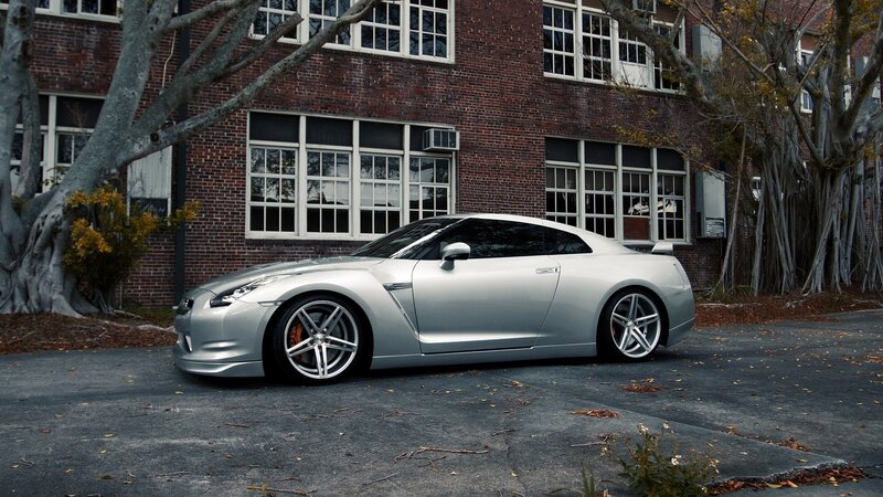 Silver sports car parked outside