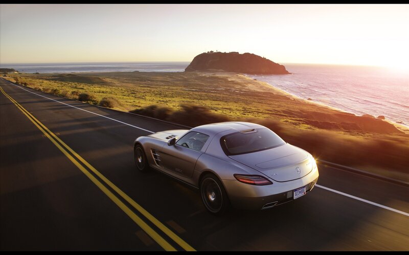 Silver Sports Car — Serene, Sunset, Photograph, Coastal Road