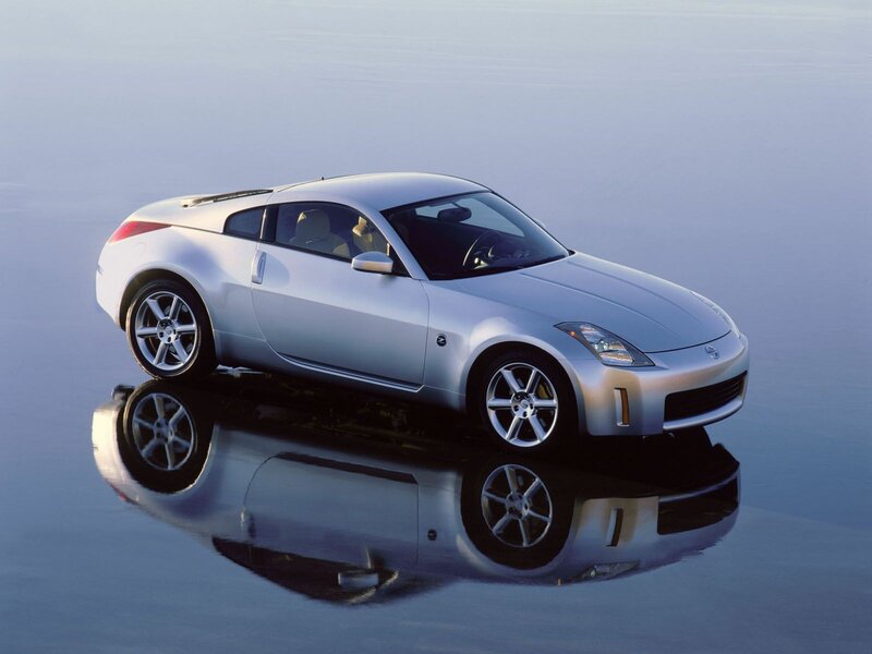 Silver Sports Car — Serene, Sunset, Photograph, Reflection
