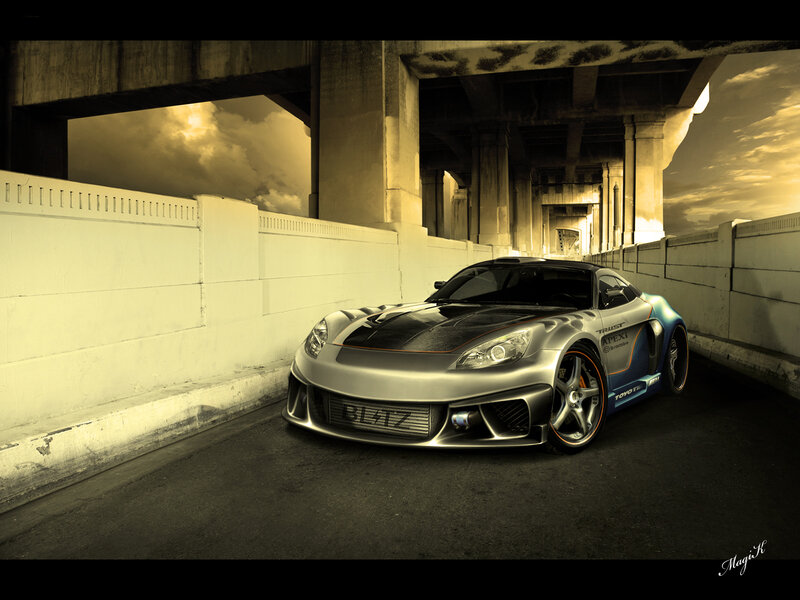 Silver sports car under a bridge