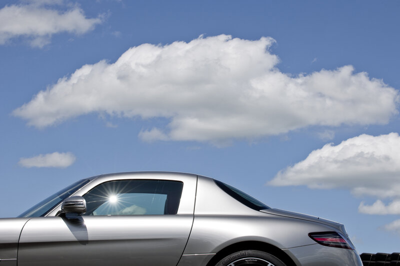 Silver sports car under blue sky