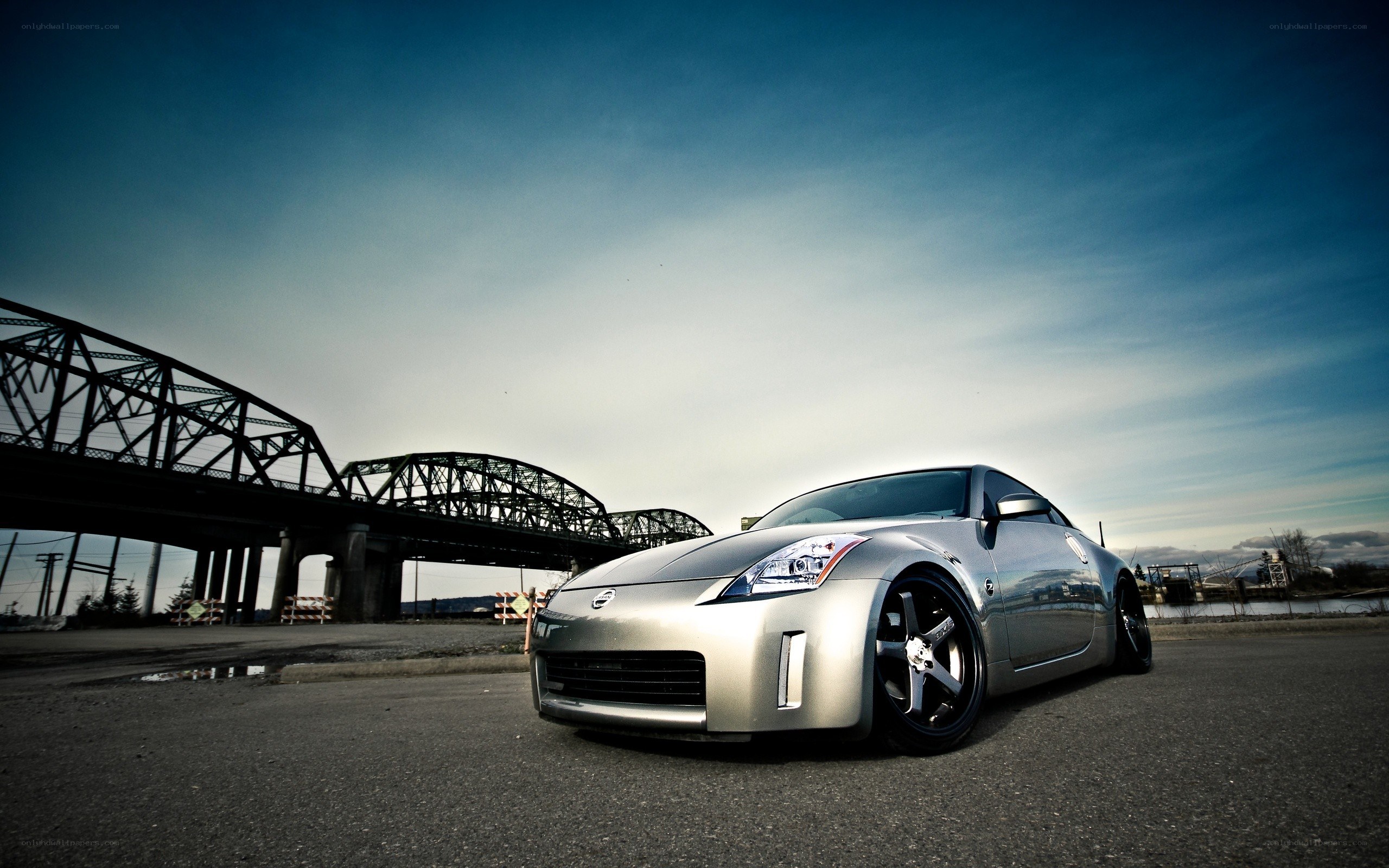 silver sports car under bridge