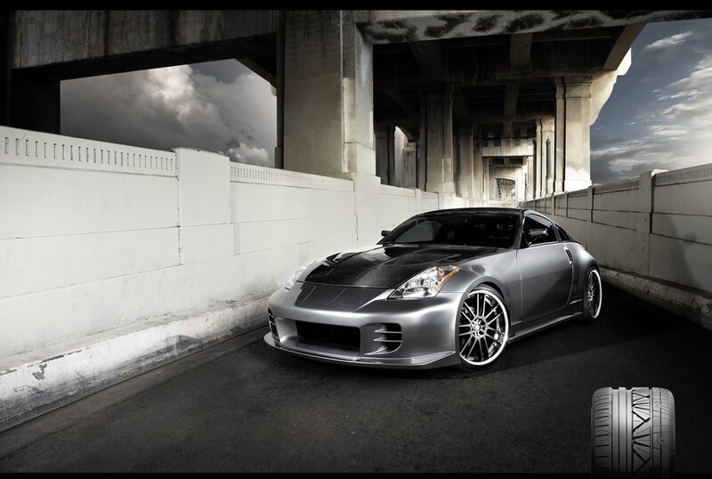 Silver sports car under overpass