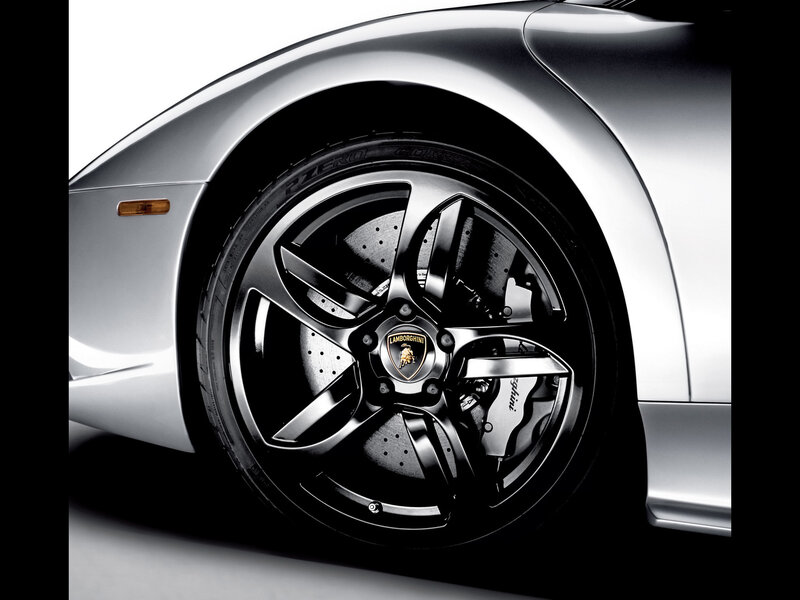 Silver Sports Car Wheel — Dramatic, Photograph