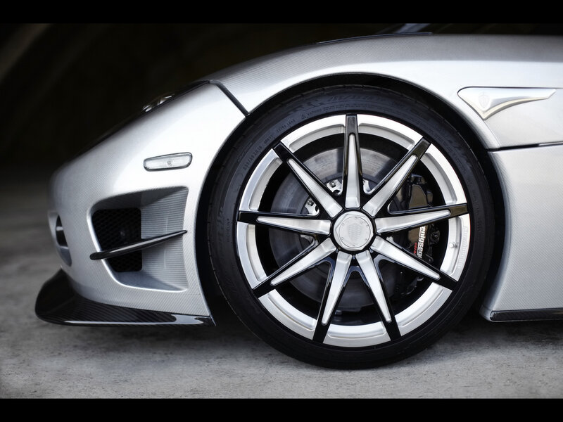 Silver Sports Car Wheel — Dramatic