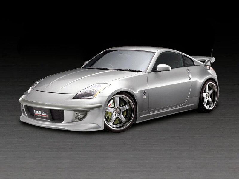 silver sports car with custom wheels