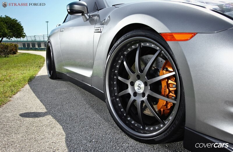 Silver sports car with custom wheels