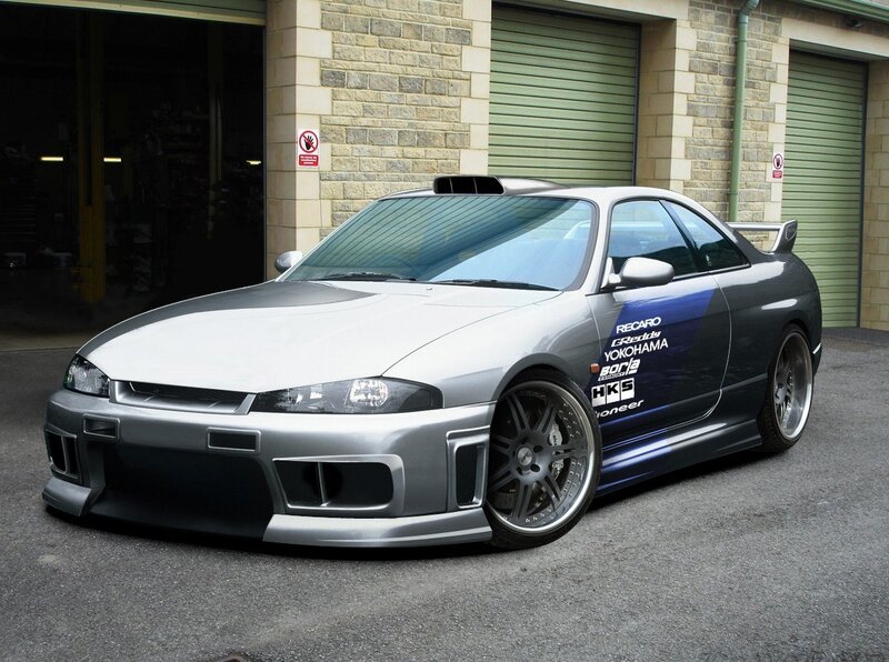 silver sports car with decals