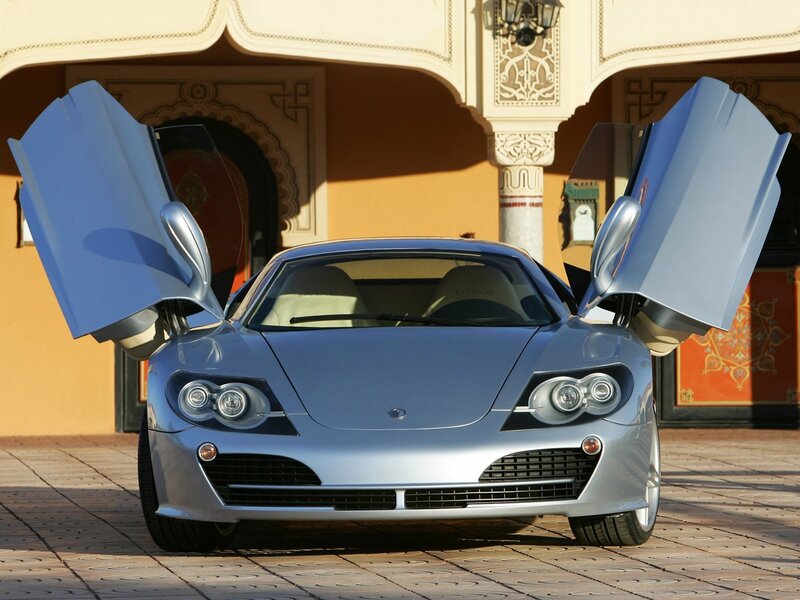 silver sports car with doors open