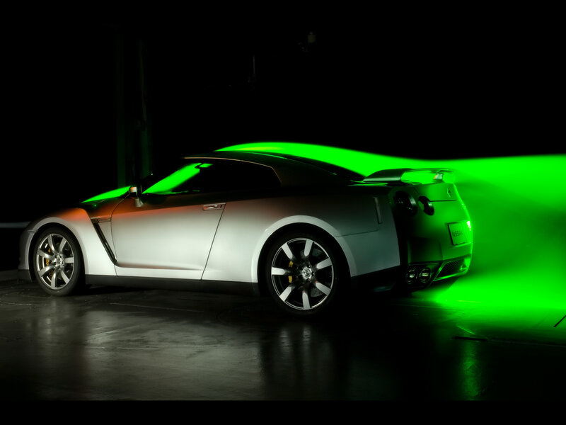 Silver sports car with green light