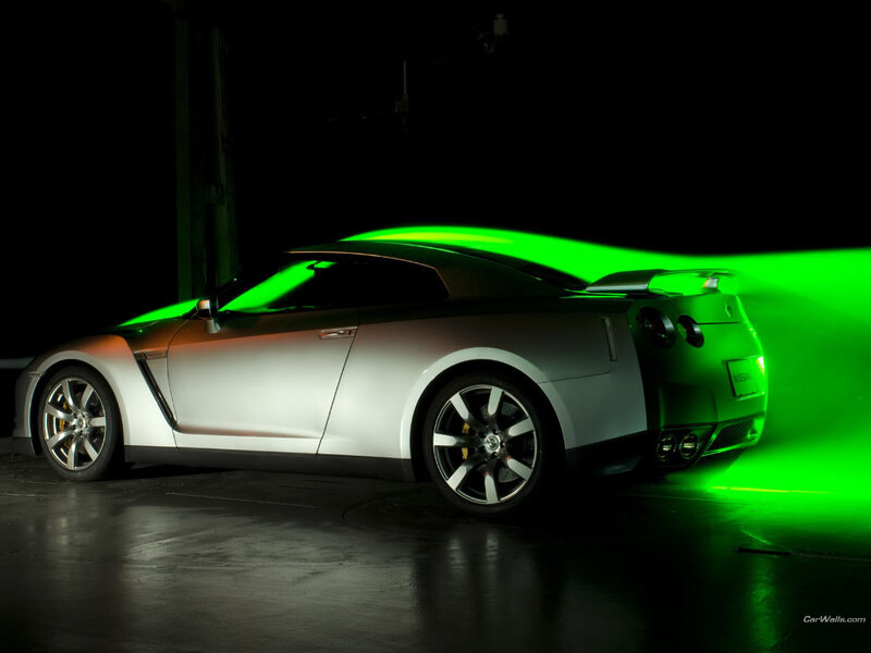 silver sports car with green light