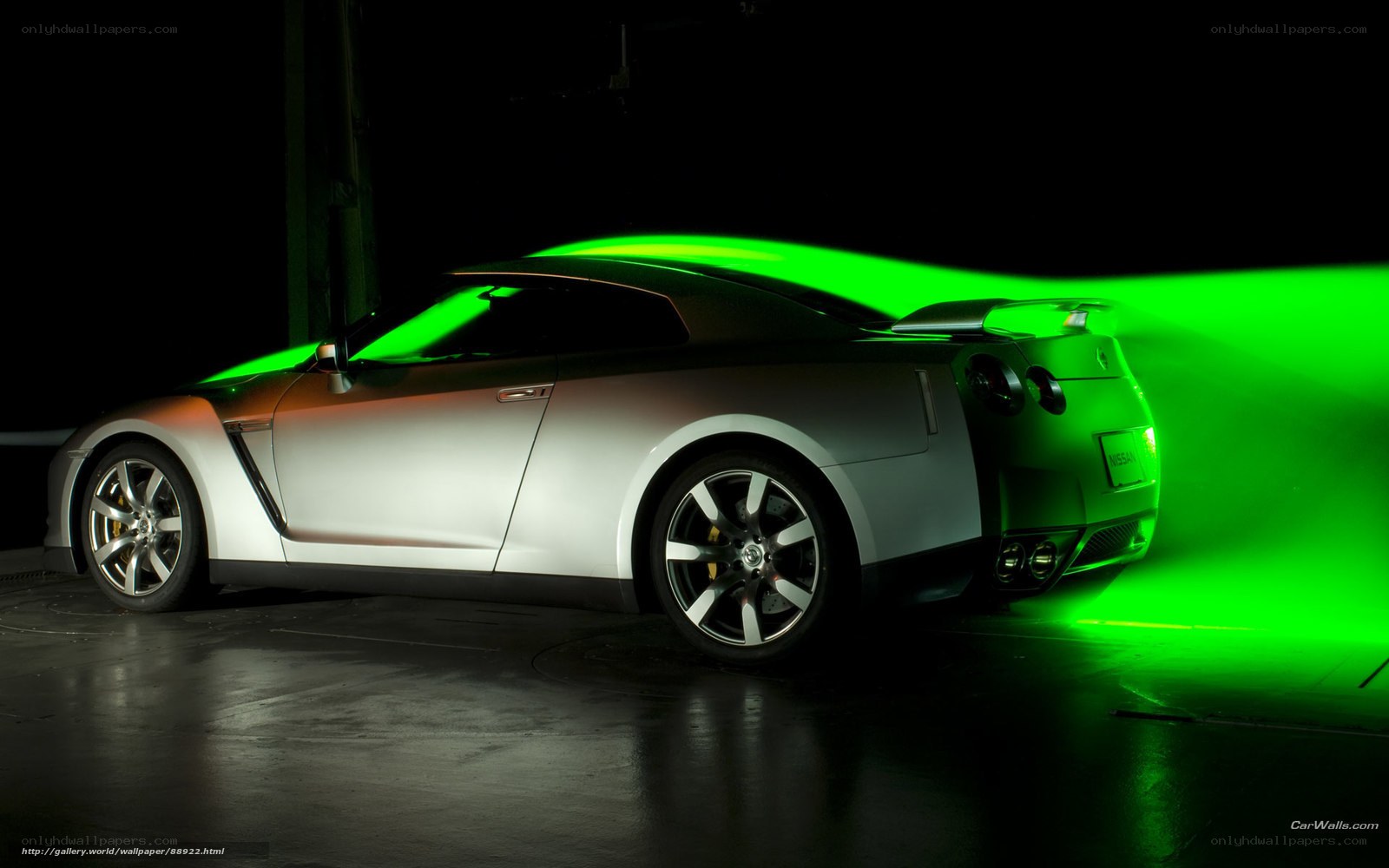 silver sports car with green light