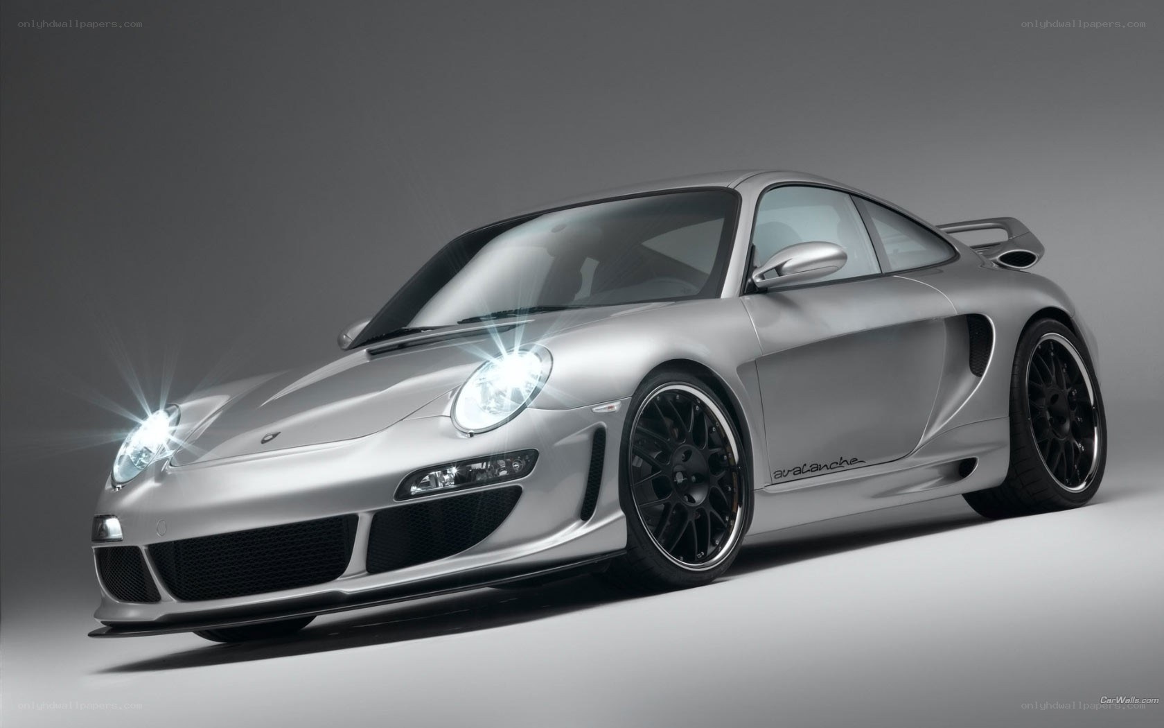 silver sports car with headlights
