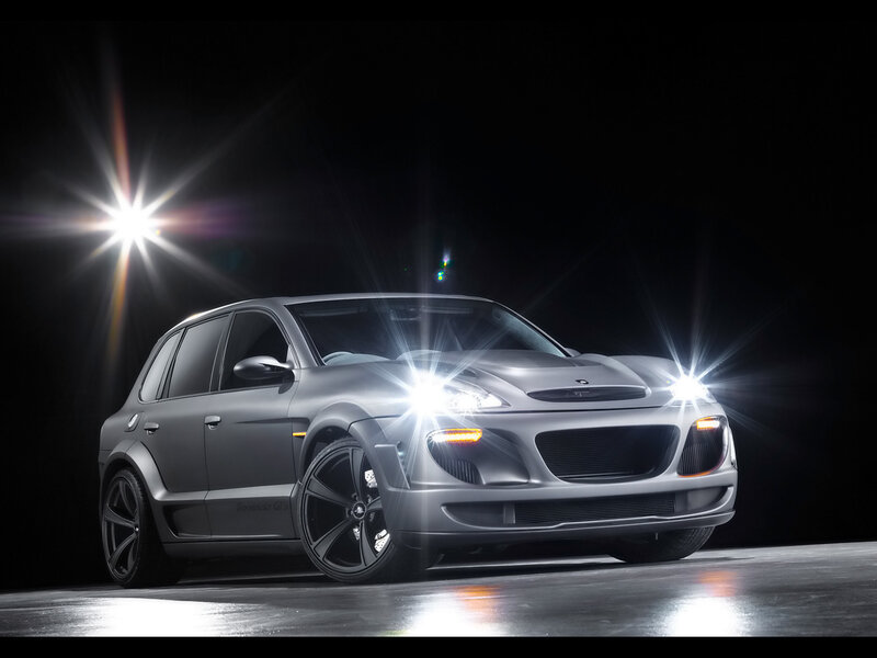 silver sports car with headlights on