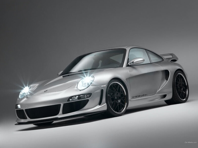 silver sports car with headlights on