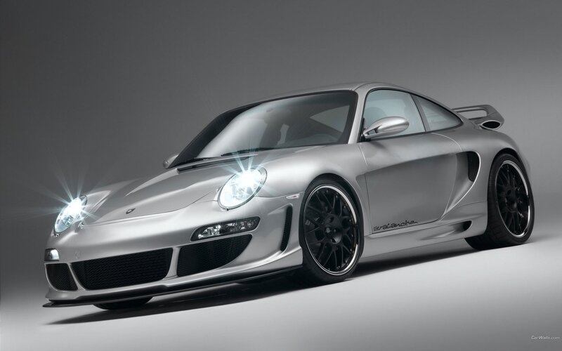 silver sports car with headlights on