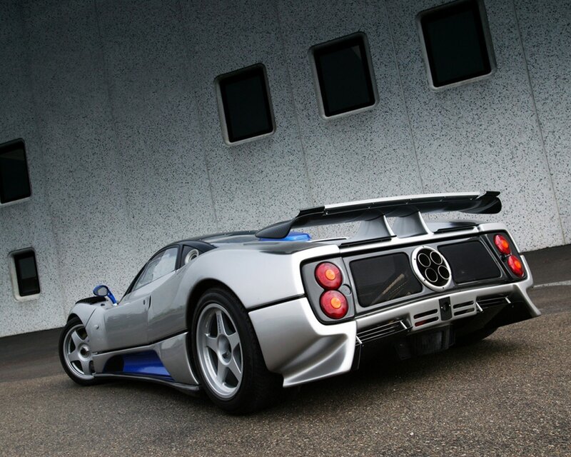 silver sports car with large wing