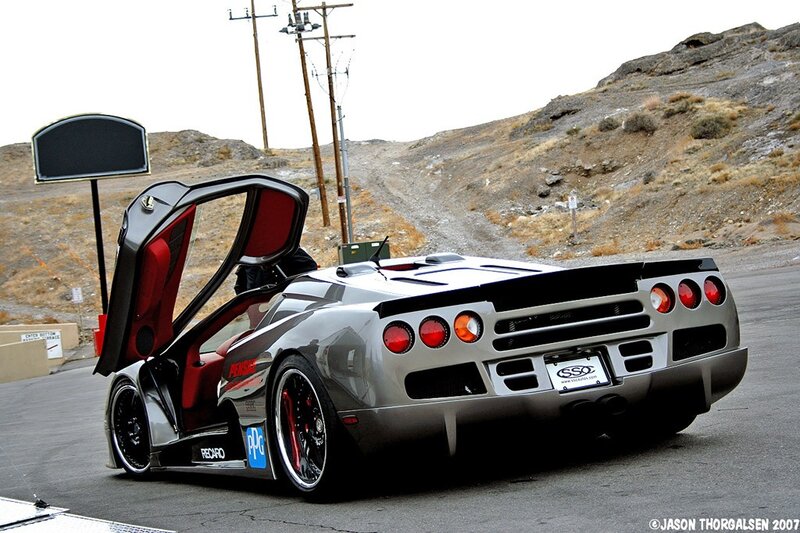 silver sports car with open door