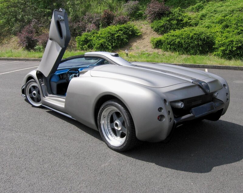 Silver sports car with open door