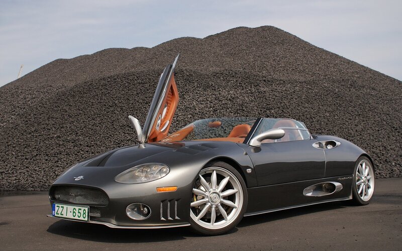 Silver sports car with open door