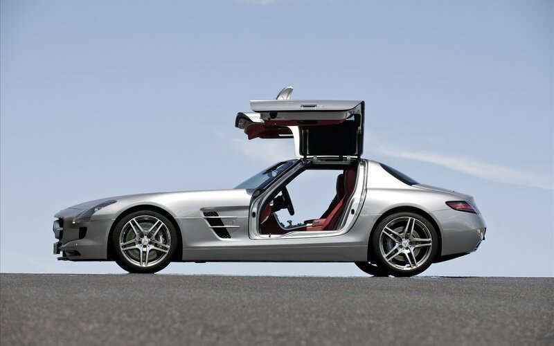 Silver sports car with open door