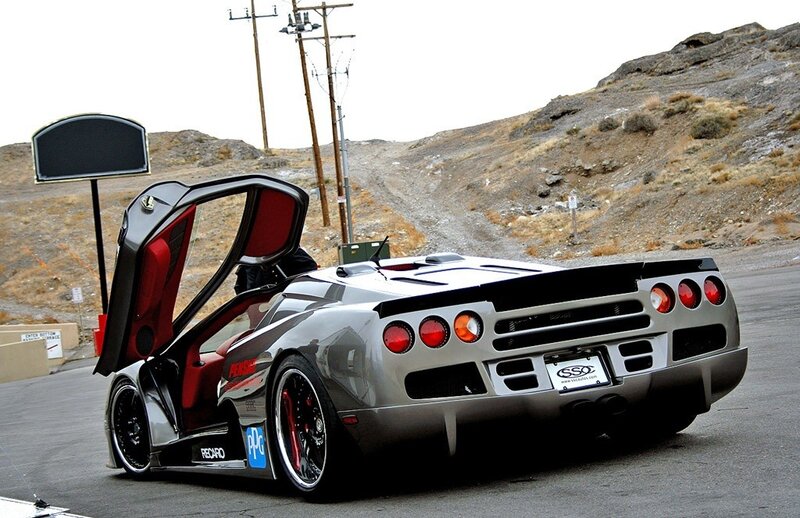 silver sports car with open door