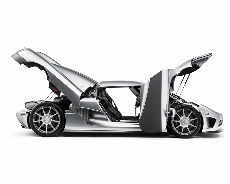 silver sports car with open doors