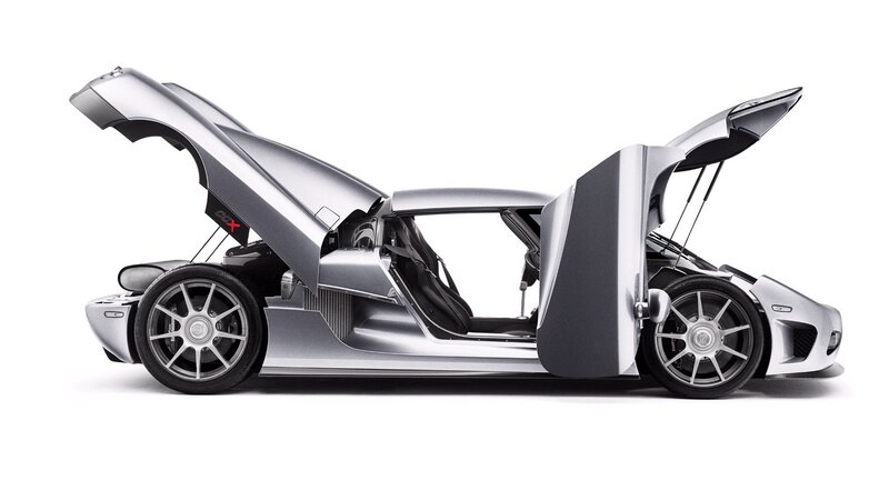 silver sports car with open doors