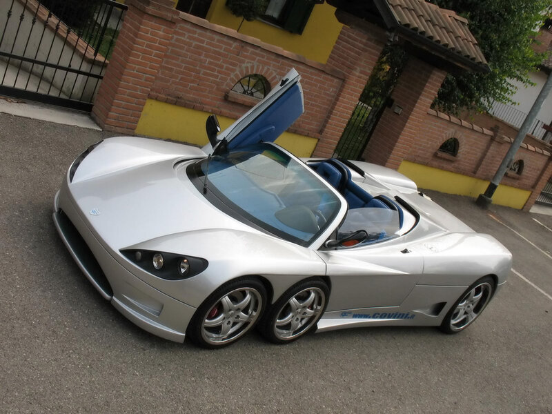 silver sports car with open doors