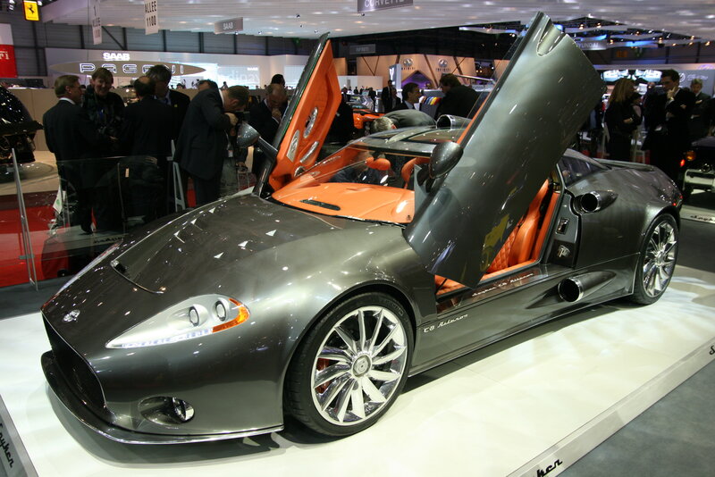 Silver sports car with open doors