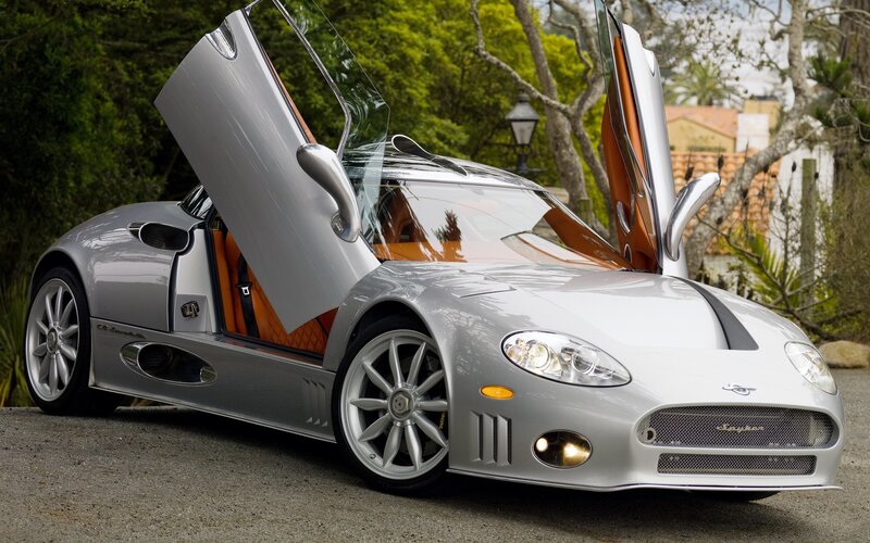 silver sports car with open doors