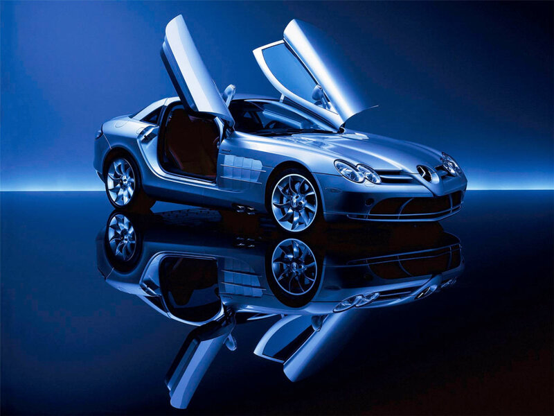 Silver sports car with open doors