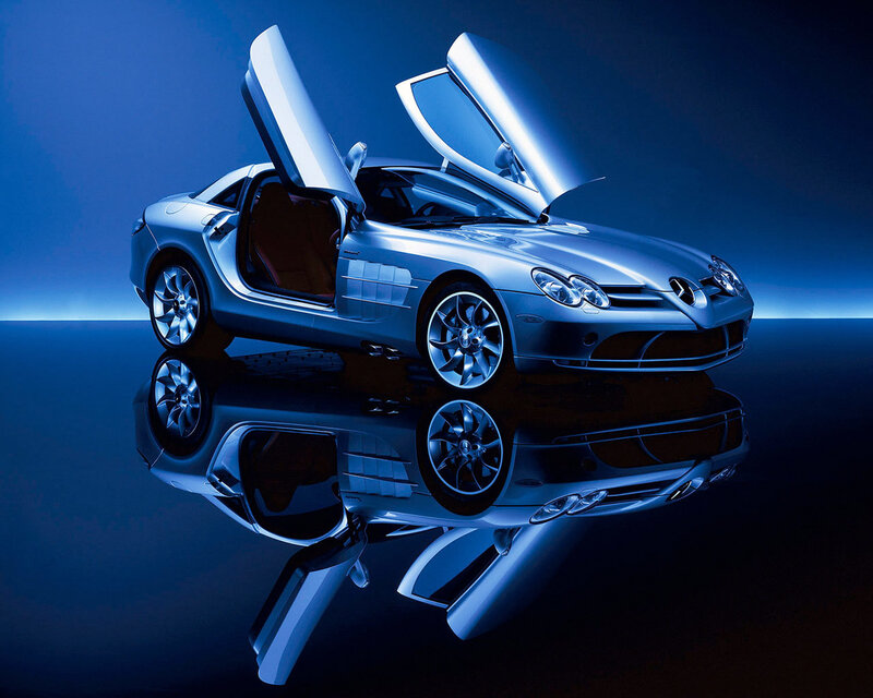 Silver sports car with open doors