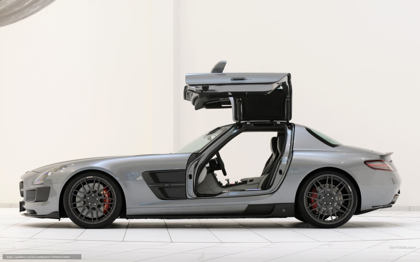 silver sports car with open doors