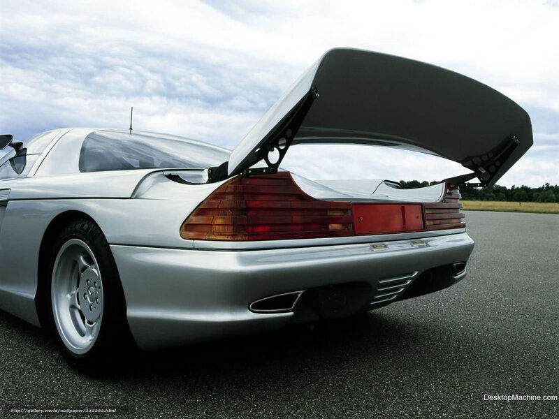 silver sports car with open trunk