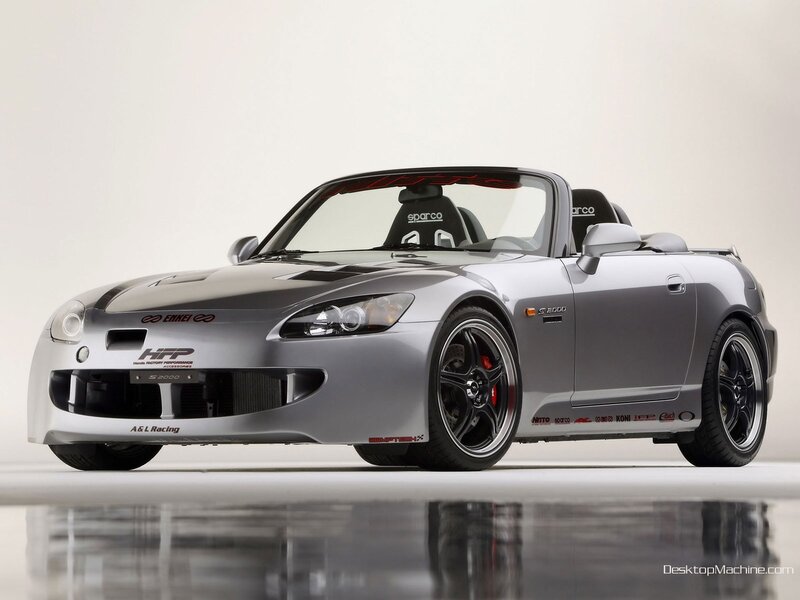 silver sports car with racing decals