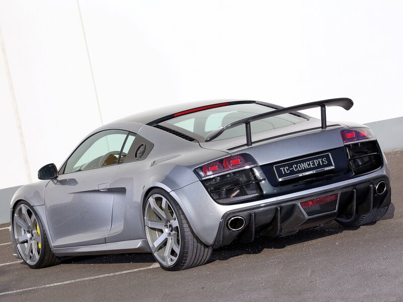 silver sports car with rear wing
