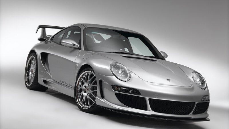 silver sports car with rear wing