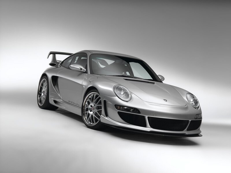 silver sports car with rear wing