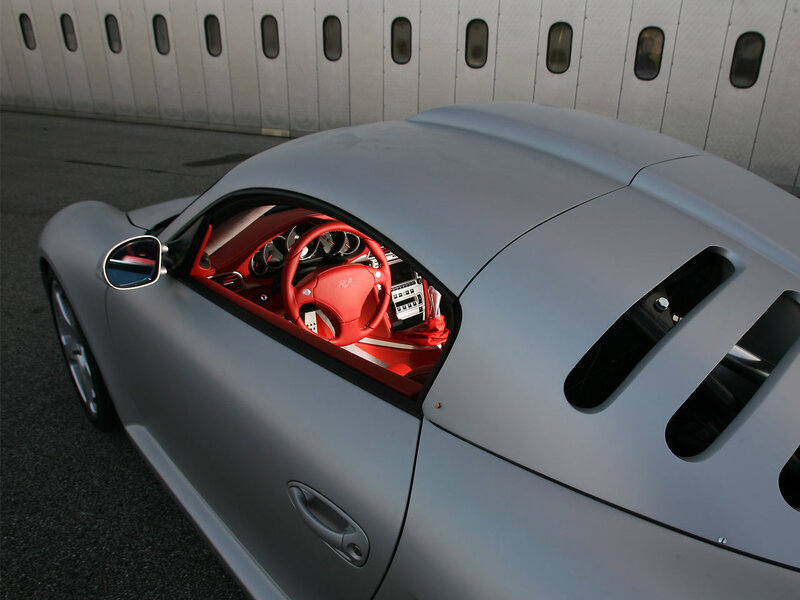 silver sports car with red interior