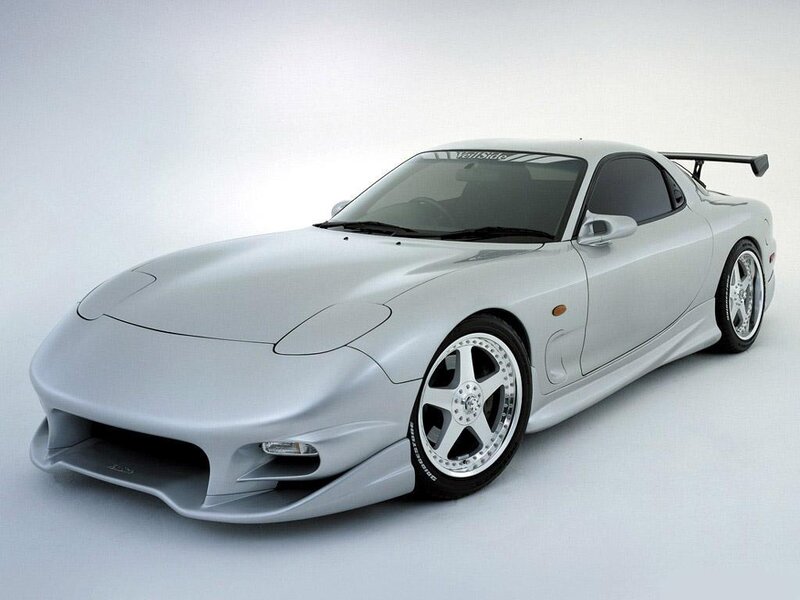 silver sports car with spoiler