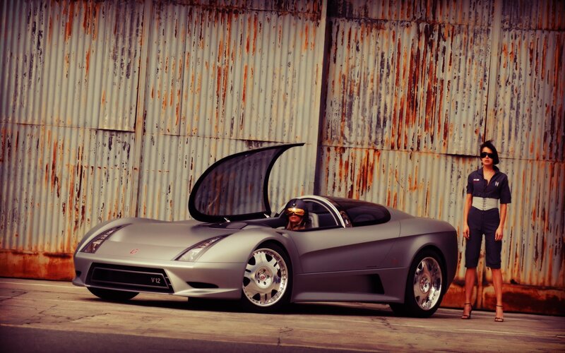 Silver sports car with two people
