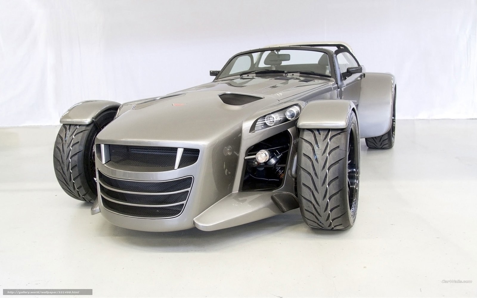 silver sports car with wide tires