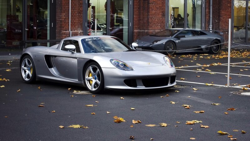 Silver sports cars in parking lot