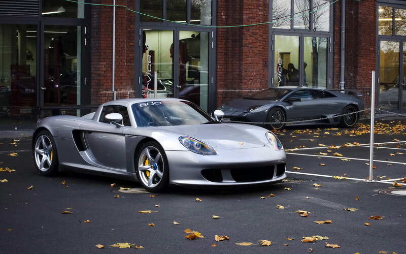 Silver sports cars in parking lot