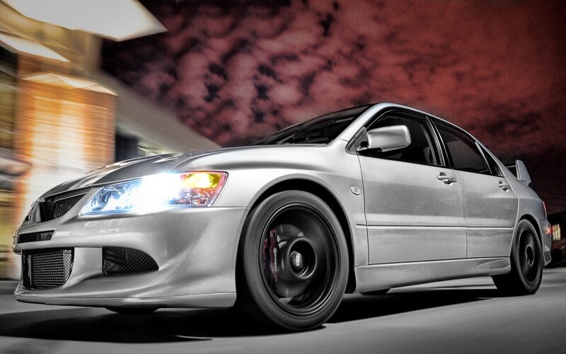 silver sports sedan at night