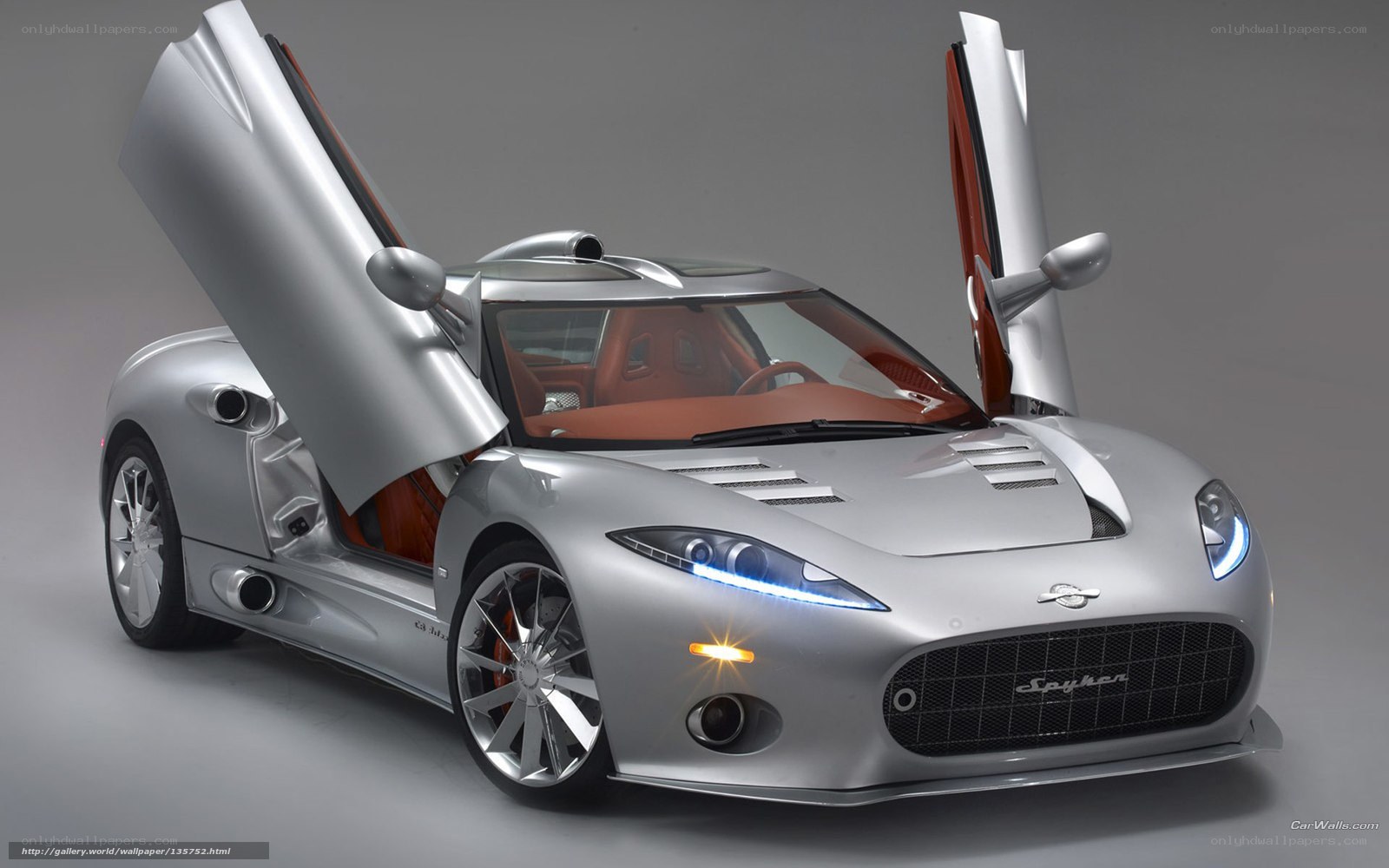 silver spyker car with doors open