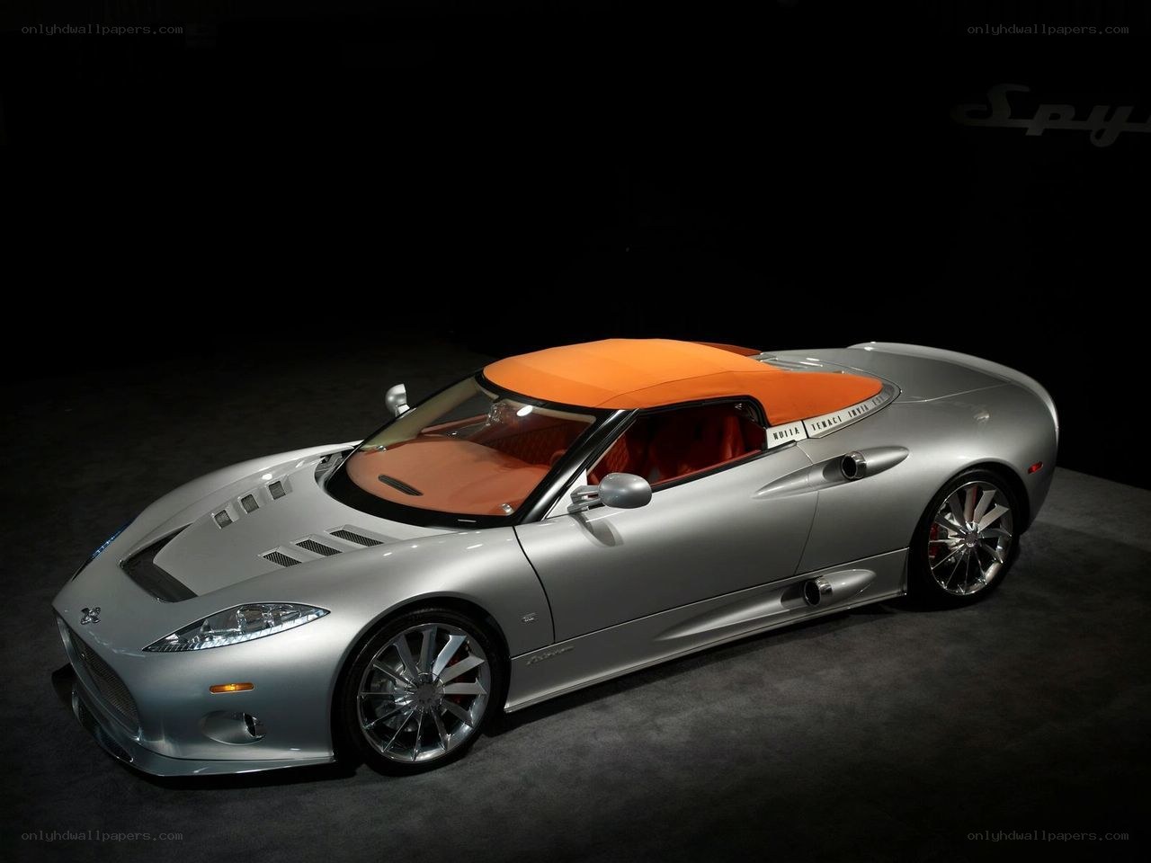 silver spyker car with orange top