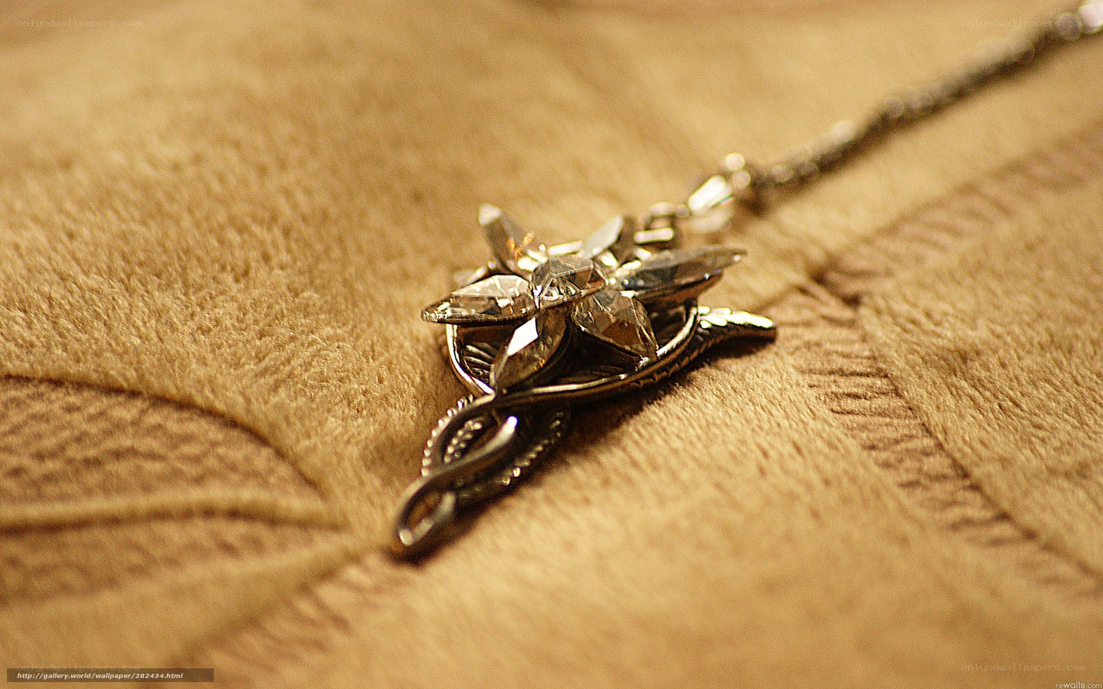 silver star pendant on fabric
