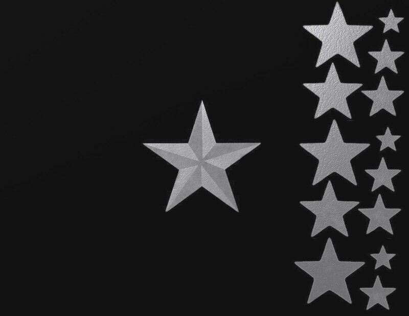 silver stars on black background
